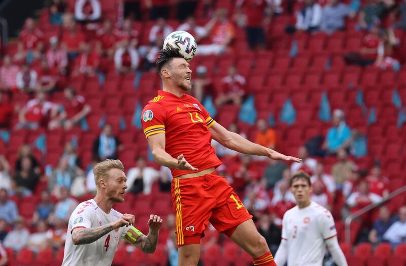 Kieffer Moore - 4: Big Cardiff City striker was booked in first half after catching Kjaer in face with elbow and looked out of his depth against the fleet-footed Danes, albeit with poor service from teammates. Reuters