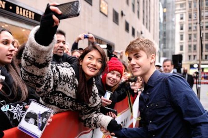 Justin Bieber poses for fans. AP Photo / NBC, Peter Kramer