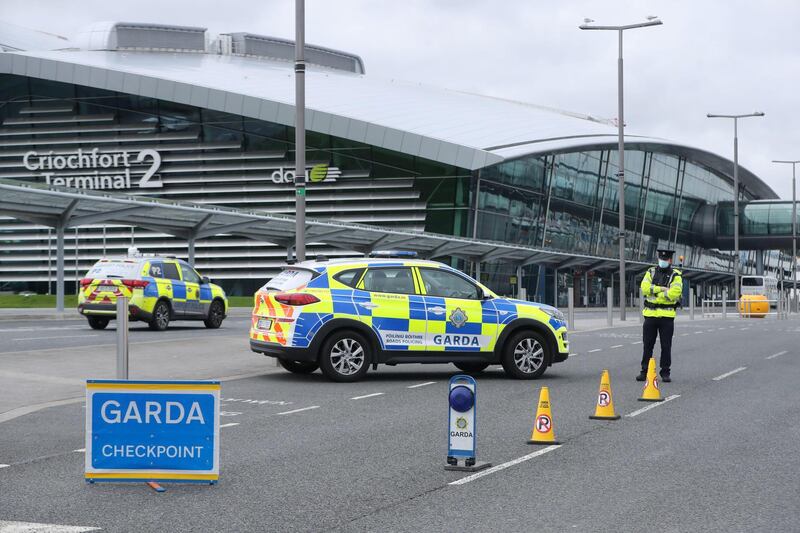 2F4MYGB Garda perform Covid-19 stop checks outside Terminal 2 at Dublin Airport. People arriving from 33 countries flagged as high risk will have to quarantine in hotels for 14 days. Mandatory quarantine will also apply to people arriving into Ireland without a negative PCR test. Picture date: Monday March 22, 2021.