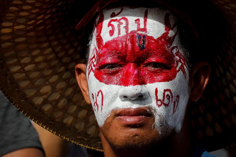 A supporter of former Thai prime minister Yingluck Shinawatra. Yingluck failed to appear in court for the verdict of her corruption trial.  Diego Azubel / EPA