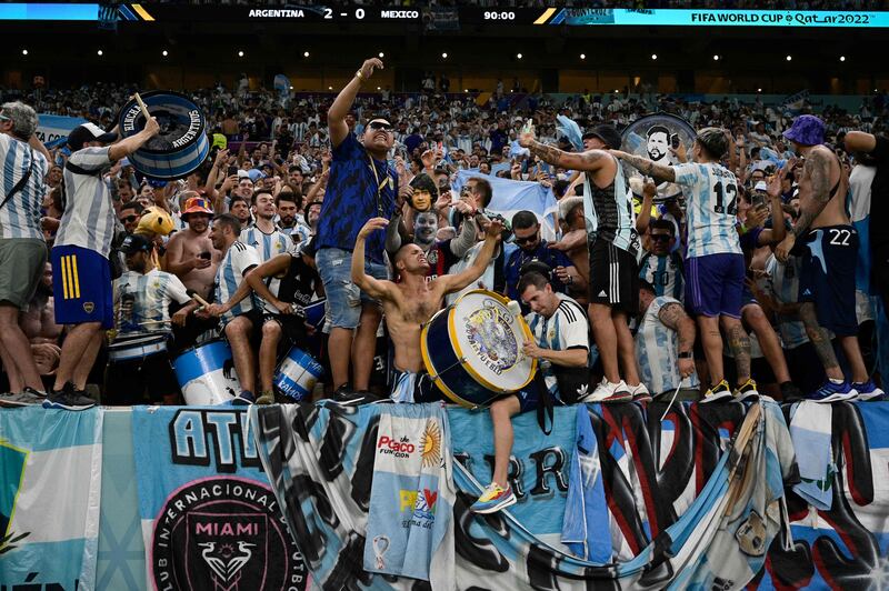 Argentina fans celebrate after their crucial Group C victory. AFP