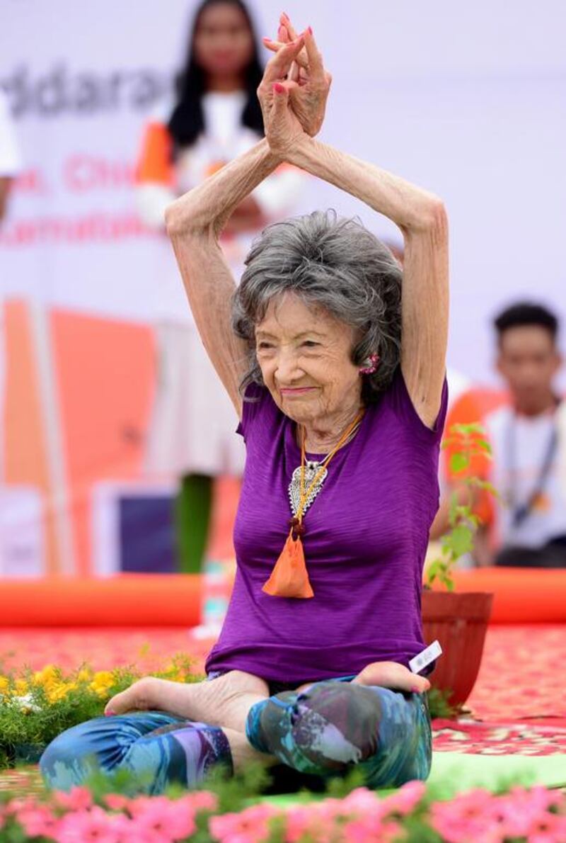 Yoga master Tao Porchon-Lynch, 98, takes part in a mass yoga session on International Yoga Day at the Shree Kanteerava Stadium in Bangalore. Manjunath Kiran / AFP