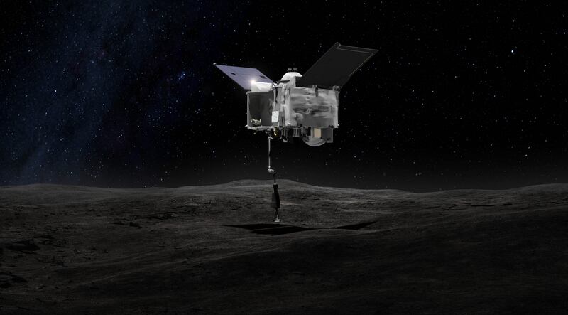 An artist impression of the spacecraft collecting a sample from the asteroid Bennu. Nasa