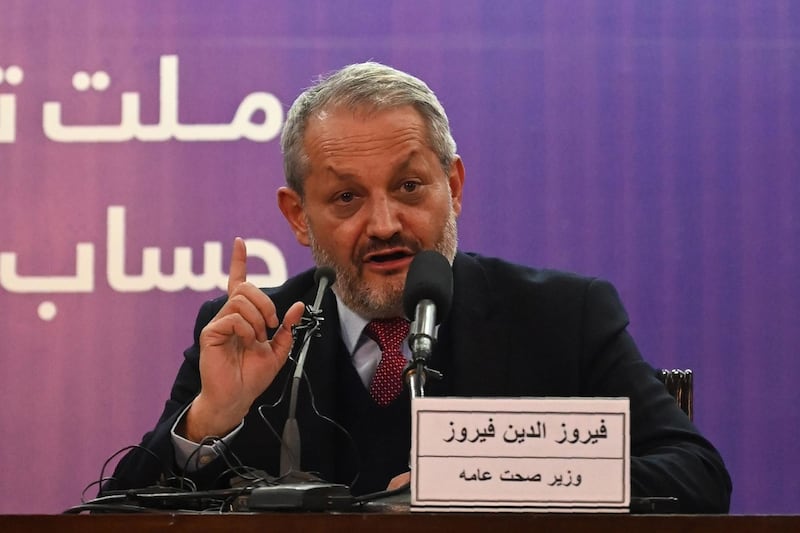 Afghanistan's Health Minister Ferozuddin Feroz gestures as he speaks during a press conference in Kabul. AFP