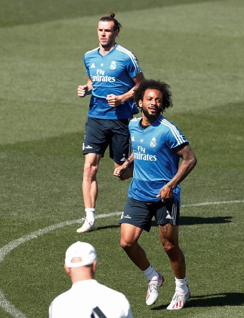 Real Madrid players Gareth Bale, left,  and Marcelo are put through their paces in training. EPA