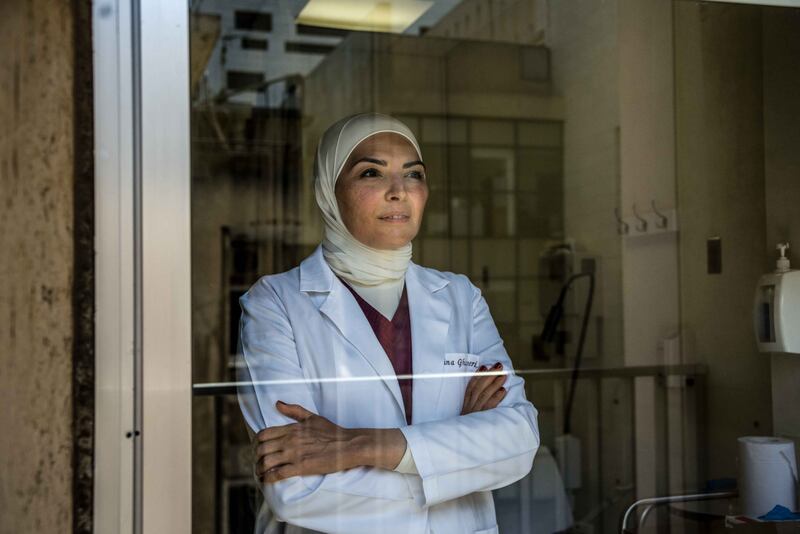 Obstetrics and gynecology specialist Dr Ghina Ghazeeri takes a moment before greeting patients at AUBMC Beirut, Lebanon. Elizabeth Fitt / The National