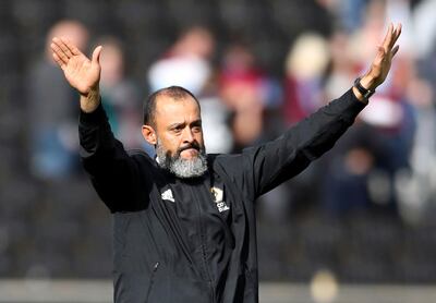 Wolverhampton Wanderers manager Nuno Espirito Santo gestures to the fans after the English Premier League soccer match between Wolverhampton Wanderers and Burnley, at Molineux, in Wolverhampton, England,  Sunday Sept. 16, 2018. (Nick Potts/PA via AP)