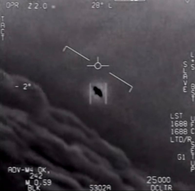 (FILES) This file video grab image obtained April 28, 2020 courtesy of the US Department of Defense shows part of an unclassified video taken by Navy pilots that have circulated for years showing interactions with "unidentified aerial phenomena". Are aliens watching us? 
That's what Americans hope to find out when a report on the US government's secret files on UFOs goes to Congress next month after years of sightings and videos suggesting that highly advanced extraterrestrials are, indeed, out there.
But the report from the Director of National Intelligence, pulled together with classified military files, could fall short of explaining scores of purported unidentified flying object incidents over decades.
 - RESTRICTED TO EDITORIAL USE - MANDATORY CREDIT "AFP PHOTO /US DEPARTMENT OF DEFENSE/HANDOUT " - NO MARKETING - NO ADVERTISING CAMPAIGNS - DISTRIBUTED AS A SERVICE TO CLIENTS
 / AFP / DoD / Handout / RESTRICTED TO EDITORIAL USE - MANDATORY CREDIT "AFP PHOTO /US DEPARTMENT OF DEFENSE/HANDOUT " - NO MARKETING - NO ADVERTISING CAMPAIGNS - DISTRIBUTED AS A SERVICE TO CLIENTS
