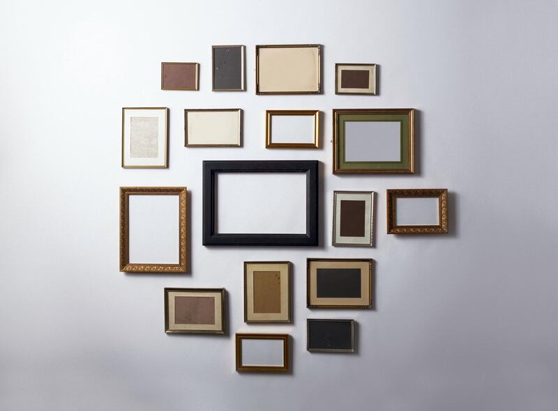 A gallery wall is the ideal way to display memories. Getty