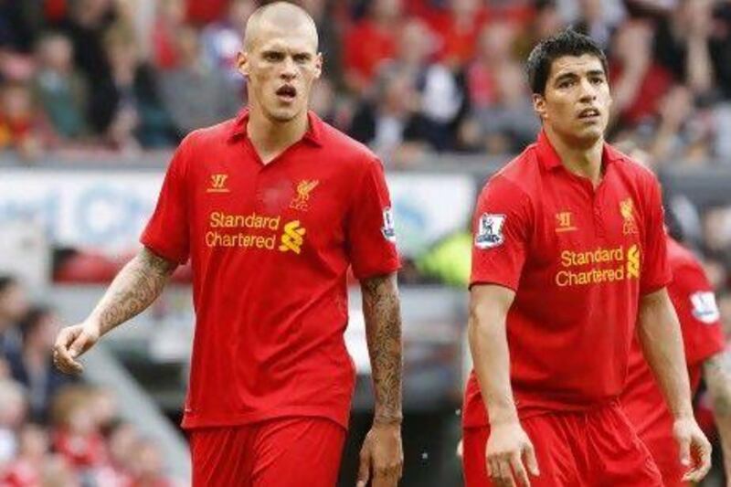 Liverpool’s Luis Suarez and Martin Skrtel after the 2-0 loss to Arsenal, they have only won one point in the first three games.