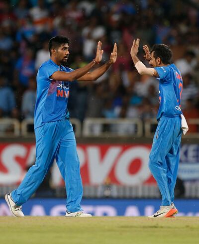 India's Jasprit Burma, left, and Yuzvendra Chahal celebrate the dismissal of Australia's Coulter-Nile during their first T20 cricket match in Ranchi, India, Saturday, Oct. 7, 2017. (AP Photo/Altaf Qadri)