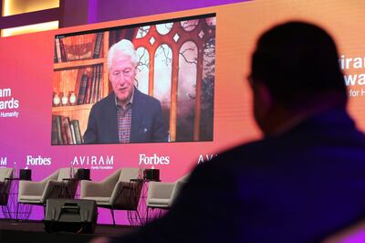 Former president Bill Clinton speaks about the war in Ukraine at a tech awards event in Dubai on March 22, 2022. Chris Whiteoak / The National