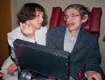 British astrophysicist Dr. Stephen Hawking, 47, answers newsmen with the help of his computer and the assistance of his wife Jane, in Paris, March 3, 1989.  Hawking, who has a motor neuron disease communicates with the help of a voice-equipped computer.  (AP Photo/Lionel Cironneau)