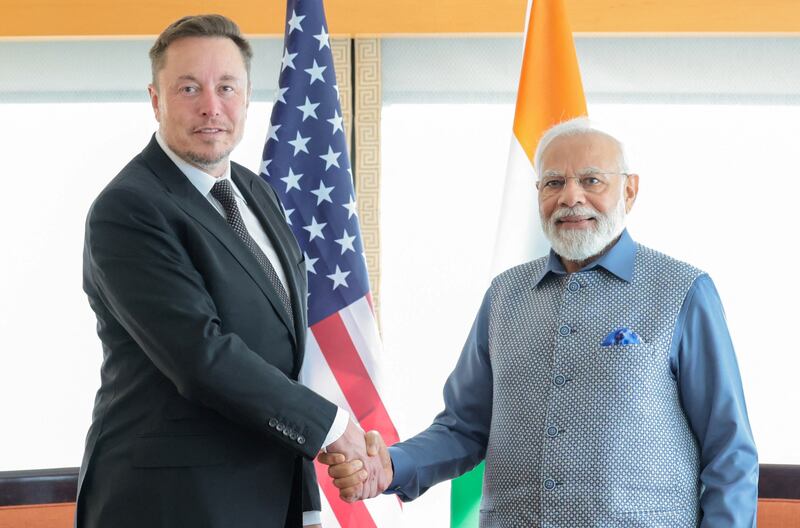 Mr Modi shakes hand with Tesla chief executive Elon Musk during their meeting in New York. Reuters