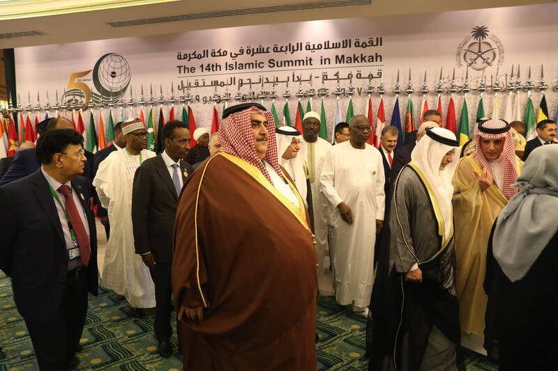 Bahrain's Foreign Minister Khalid bin Ahmed al-Khalifa, centre, leaves after the photo session in Jeddah.  AFP