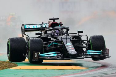 IMOLA, ITALY - APRIL 18: Lewis Hamilton of Great Britain driving the (44) Mercedes AMG Petronas F1 Team Mercedes W12 lifts a wheel` during the F1 Grand Prix of Emilia Romagna at Autodromo Enzo e Dino Ferrari on April 18, 2021 in Imola, Italy. (Photo by Bryn Lennon/Getty Images)