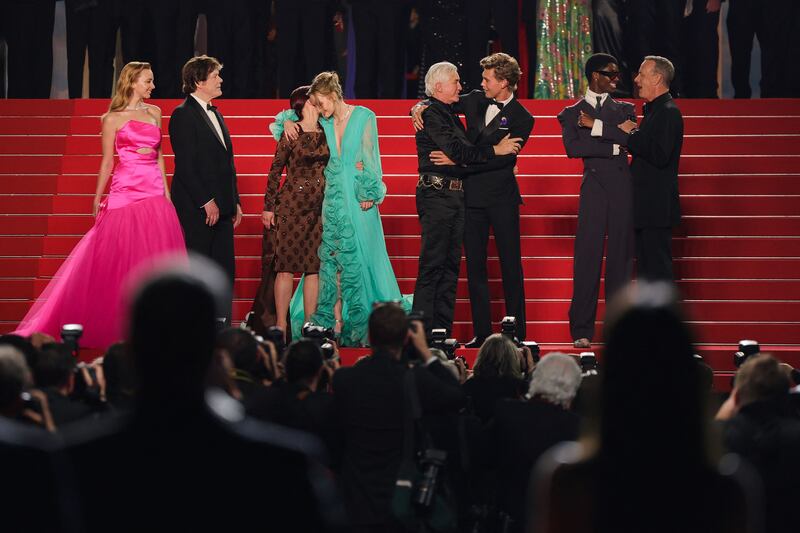 From left, Australian actress Natasha Bassett, producer Jerry Schilling, Priscilla Presley, Australian actress Olivia DeJonge, Australian director Baz Luhrmann, US actor Austin Butler, actor Alton Mason and US actor Tom Hanks leave the Festival Palace following the screening of the film 'Elvis' during the 75th Cannes Film Festival. AFP