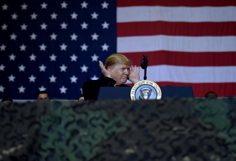 On a brief visit to Bagram Airfield outside the capital Kabul, Mr Trump served turkey dinner to soldiers, posed for photographs and delivered a speech. AFP