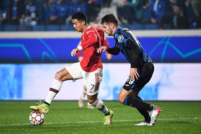 Manchester United forward Cristiano Ronaldo fights for the ball with Atalanta's Berat Djimsiti. AFP
