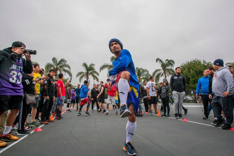 Manny Pacquiao trains in the morning with fans and friends at Pan Pacific Park in Los Angeles. AFP