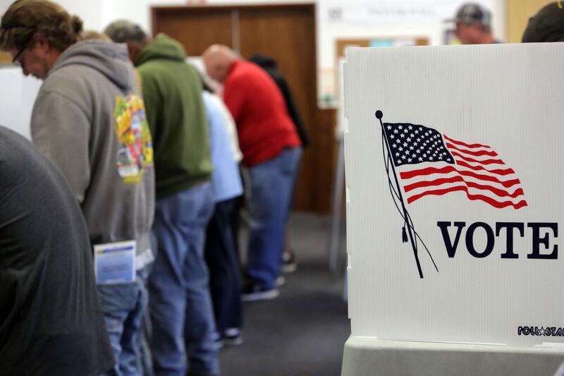 (FILES) In this file photo taken on November 8, 2016 voters cast ballots at a polling station at the Big Bear Lake Methodist Church in Big Bear, California. Might the anticipated Democratic "blue wave" in the coming US elections yet fizzle? With midterm elections on November 6, 2018, the polls leave room for doubt. Democrats, while still favored overall, have been unable to build a decisive edge over the Republicans of US President Donald Trump, meaning the president might yet manage to avoid the electoral slap-down the minority party had hoped to inflict.  / AFP / Bill Wechter / TO GO WITH AFP STORY by Elodie CUZIN, "US elections: Democrats remain favored but Trump has pushed back " 
