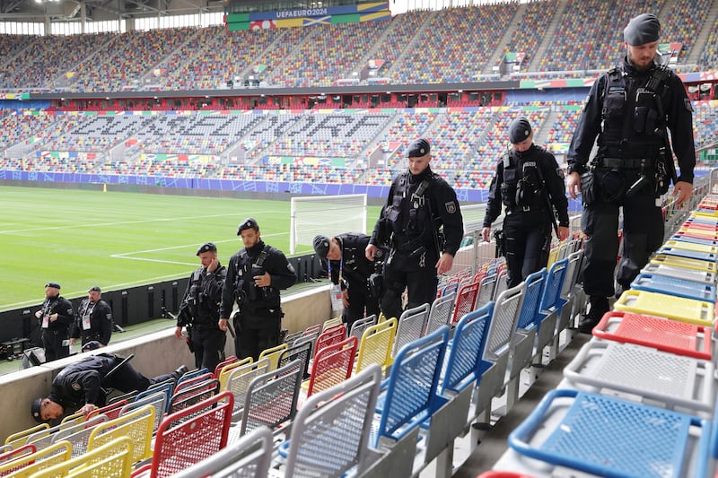 Police search the UEFA soccer stadium in Dusseldorf, Germany, for suspicious objects, ahead of the European Championship, Thursday, June 13, 2024.  (David Young / dpa via AP)