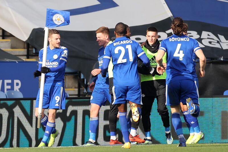 Leicester City's striker Jamie Vardy, left, celebrates with teammates after scoring his team's second goal. AFP