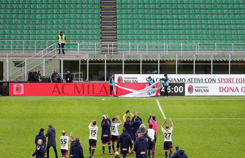 Genoa players celebrate after the Italian Serie A soccer match at AC Milan. EPA