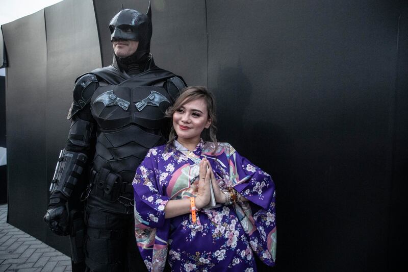 A woman in cosplay poses with Batman at the Middle East Film & Comic Con 2022 in Abu Dhabi. All photos by Antonie Robertson / The National, unless specified otherwise