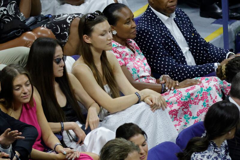 Designer Vera Wang, left, watches from the stands. Reuters