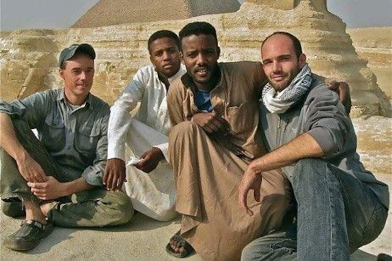 Americans archaeologist Will Raynolds (far left) was working in Libya and forced to leave and journalist Joshua Maricich (far right) was kicked out of Yemen. They bought a "felucca" (traditional Nile river boat) and named it Jasmine. Their two African crew members pose with them.