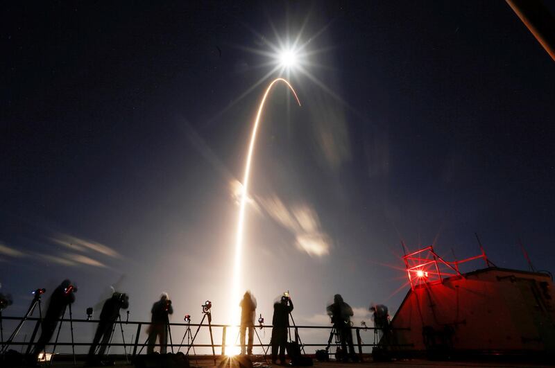 The Solar Orbiter spacecraft, built for NASA and the European Space Agency, lifts off from pad 41 aboard a United Launch Alliance Atlas V rocket at the Cape Canaveral Air Force Station in Cape Canaveral, Florida, U.S., February 9, 2020. The full moon is shown above. REUTERS/Joe Skipper     TPX IMAGES OF THE DAY