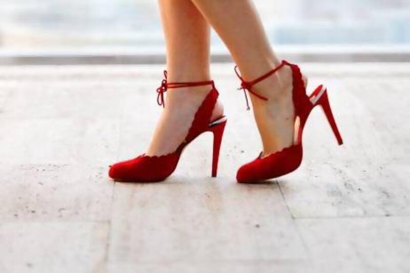 The Tala: pillar-box red, soft suede pump with ankle strap; classic shoe with scalloped detailing. Sarah Dea / The National