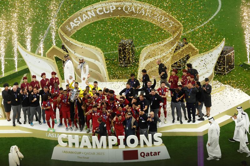 Qatar's players celebrate with the 2023 AFC Asian Cup trophy. AFP