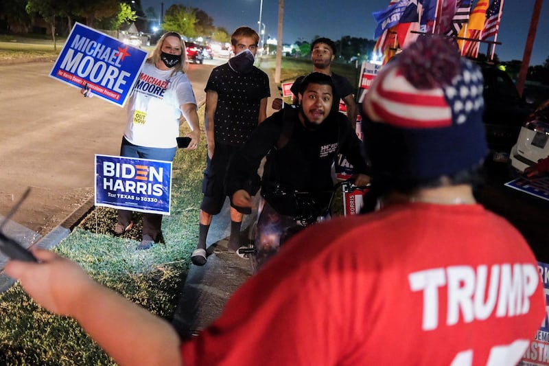 Biden supporters face off a Trump supporter outside of a polling site, on Election Day in Houston, Texas. Reuters