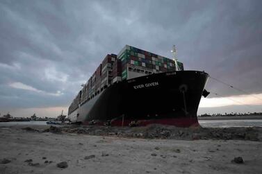 Tugboats and diggers work to free the ‘Ever Given’ container ship from the bank of the Suez Canal on March 28, 2021. Suez Canal Authority via AP