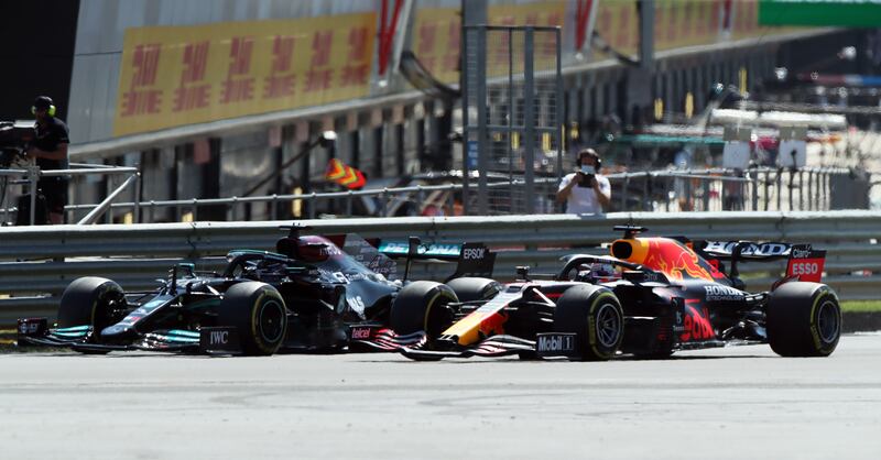 Red Bull's Max Verstappen and Lewis Hamilton before the collision that ended the Dutch driver's race.