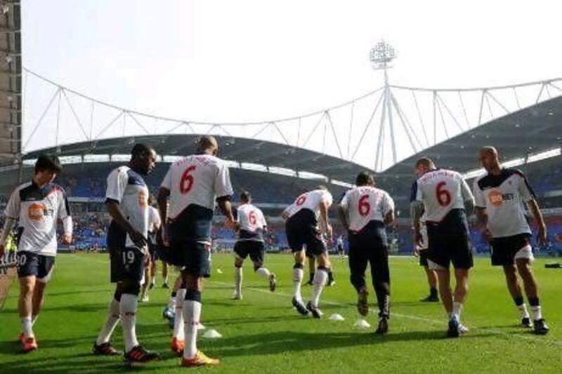 Bolton players warm up wearing "Muamba 6" jerseys prior to their home match against Blackburn.