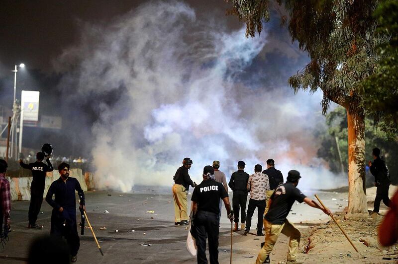 Police fire tear-gas canisters to disperse supporters of Islamic political party Tehrik Labaik Ya RasoolAllah (TLP) during a protest over the Khadim Hussain Rizvi arrest in Karachi.  Tehreek-e-Labbaik Pakistan (TLP) chief Khadim Hussain Rizvi has been taken into protective custody by the police.  EPA
