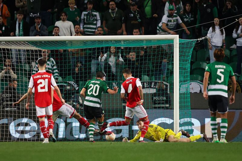 Sporting Lisbon's Portuguese forward Paulinho Dias Fernandes scores. AFP