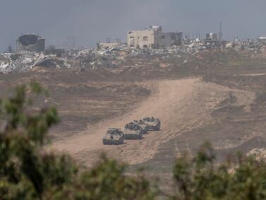 Israeli armored personnel carriers (APC's) move near the Israeli-Gaza border as seen from southern Israel, Wednesday, April 17, 2024.  (AP Photo / Ohad Zwigenberg)