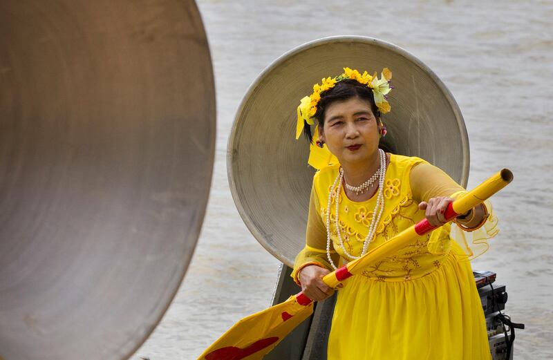 A woman performs in a cultural competition on a boat during the Shwe Kyin light festiva in Bago, Myanmar. Thein Zaw / AP Photo