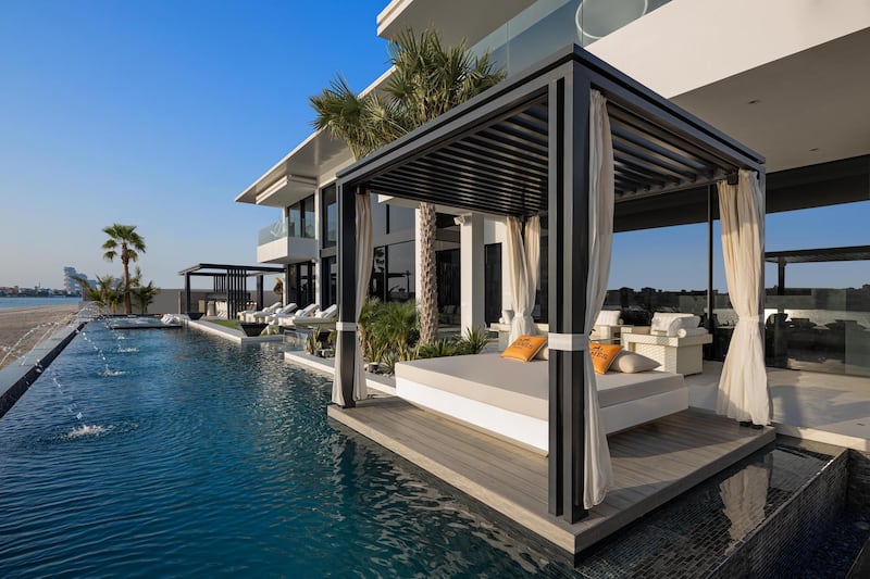 With the poolside cabanas, you could be forgiven for thinking a beach club had been put on the market. Courtesy Luxhabitat Sotheby's International Realty