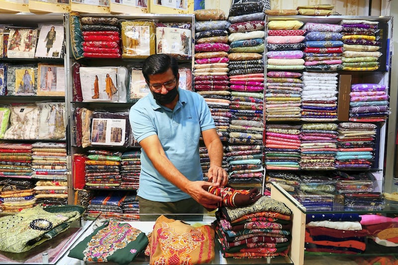 Mohammed Amjad at his shop in Meena Bazaar area in Bur Dubai in Dubai on April 5,2021. Pawan Singh / The National. Story by Sarwat