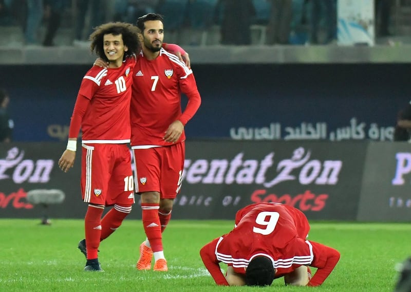 UAE's Omar Abdulrahman (L), Ali Mabkhout (2L) and Mohanad Salem celebrate after winning the penalty shoot-out at the end of the 2017 Gulf Cup of Nations semi-final football match between Iraq and the UAE at the Sheikh Jaber al-Ahmad Stadium in Kuwait City on January 2, 2018.  / AFP PHOTO / GIUSEPPE CACACE