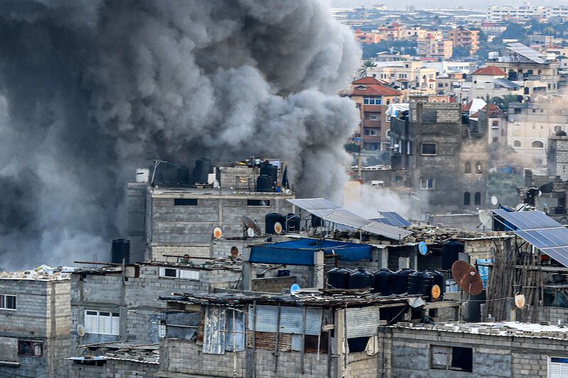 Smoke rises from buildings bombed by Israel in Rafah, in the south of the Gaza Strip, on Tuesday. AFP