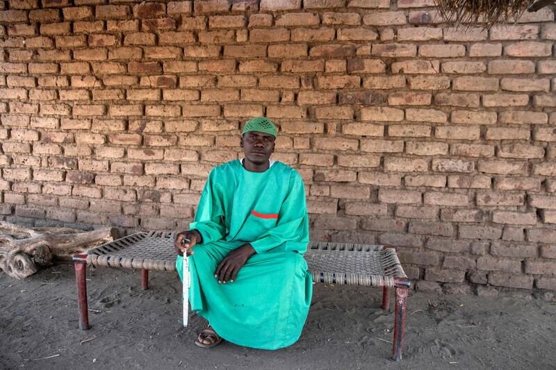 An inhabitant of Mai Carato, one of 10 villages at the limits of Al Rahd river within Dinder National Park in Sudan. AFP