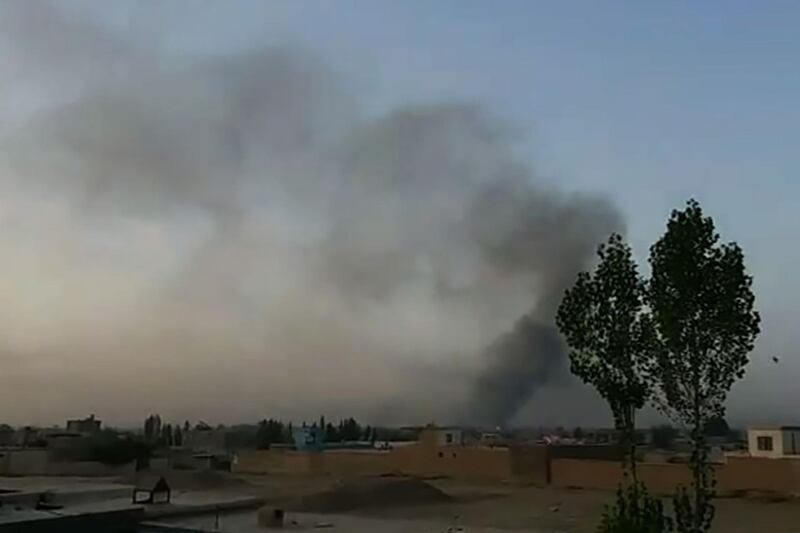 TOPSHOT - This screen grab taken from AFPTV video on August 10, 2018 shows smoke rising into the air after Taliban militants launched an attack on the Afghan provincial capital Ghazni, with terrified residents cowering in their homes amid explosions and gunfire. - At least one Afghan soldier had been killed and seven others wounded in the fighting in the southeastern city of Ghazni, a provincial governor spokesman told AFP on August 10. (Photo by AFPTV / AFPTV / AFP)