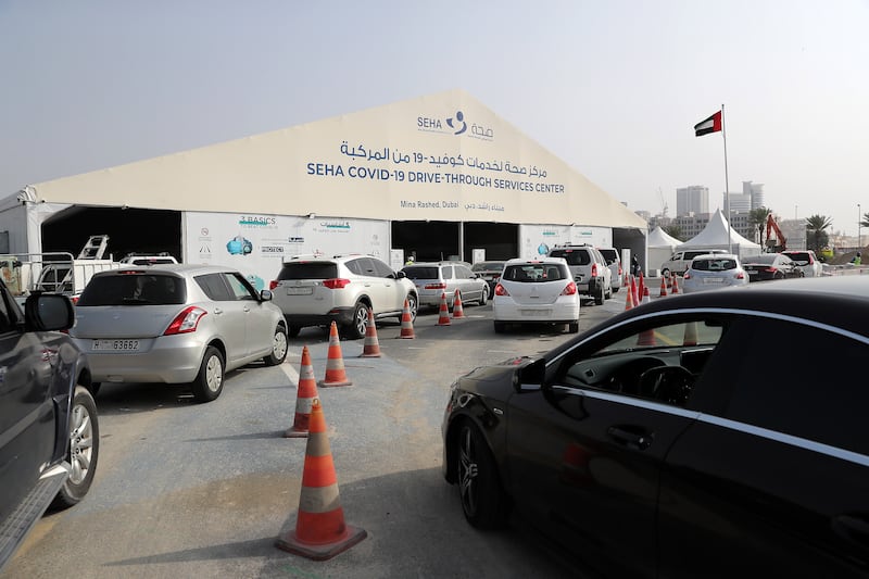 Motorists queue for a PCR test at the SEHA Covid-19 service centre at Mina Rashed, Dubai. Pawan Singh / The National