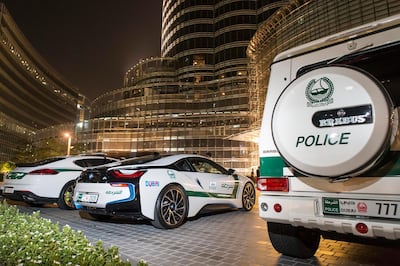 DUBAI, UNITED ARAB EMIRATES, 16 JULY 2015. The Dubai Police super luxury cars. A quick drive with Dubai Police in their BMW I8, Porche Panamera and Mercedes GWagon Brabus that ended in a photo opertunity at the Dubai Mall Fountain where members of the public had a chance to see the cars and interact with the police. (Photo: Antonie Robertson/The National) Journalist: Dana Moukhallati. Section: National. *** Local Caption ***  AR_1607_Police_Luxury_Cars-01.JPG